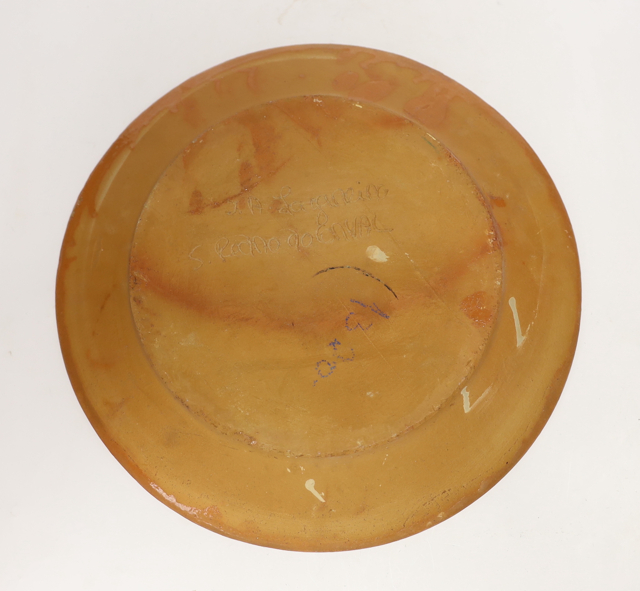 Two Portuguese glazed and incised pottery chargers, 36cm diameter